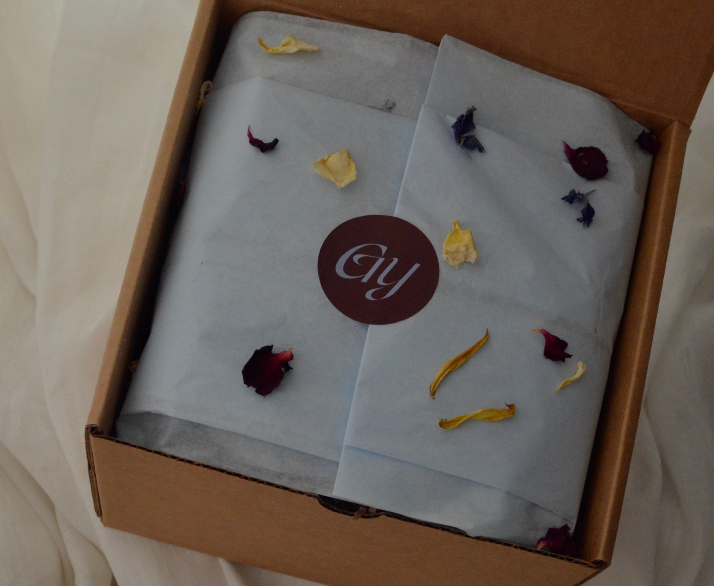 Gift box for mom to be with dried florals and pretty tissue paper